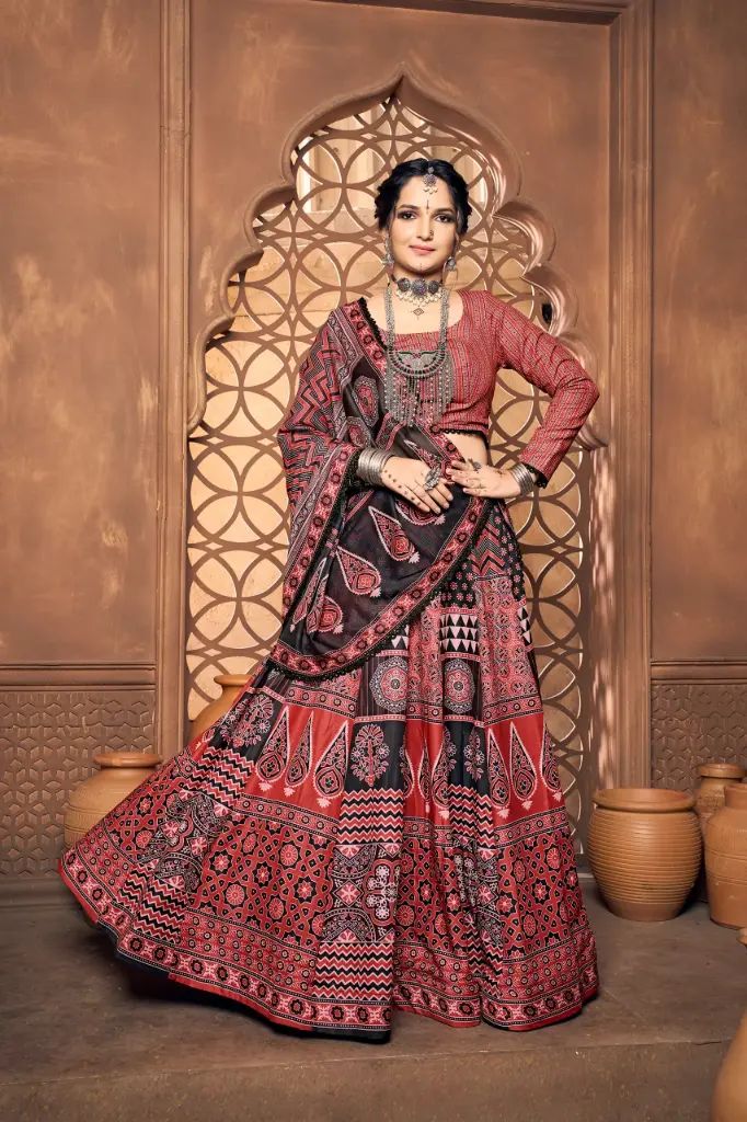 Red lehnga-choli with Ajrakh print and Princess cut full sleeves with lace touch up on Dupatta