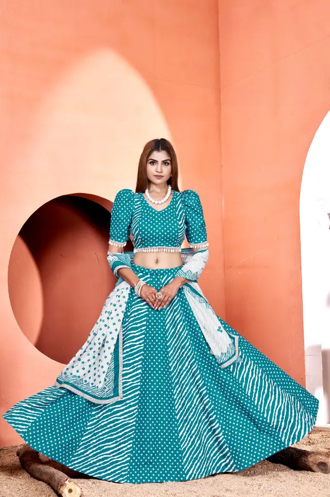 Turquoise Blue lehnga-choli with lariya and bandhni print with straight darts and mirror and lace embellishment on blouse