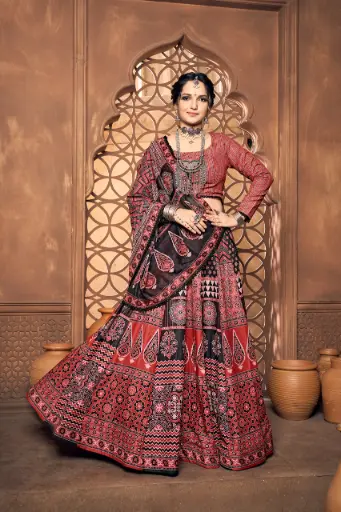 Red lehnga-choli with Ajrakh print and Princess cut full sleeves with lace touch up on Dupatta
