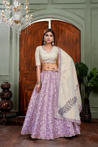 Lavandar and cream lehnga-choli with muslin shimmer fabric and lace embellishment on printed kali and flare